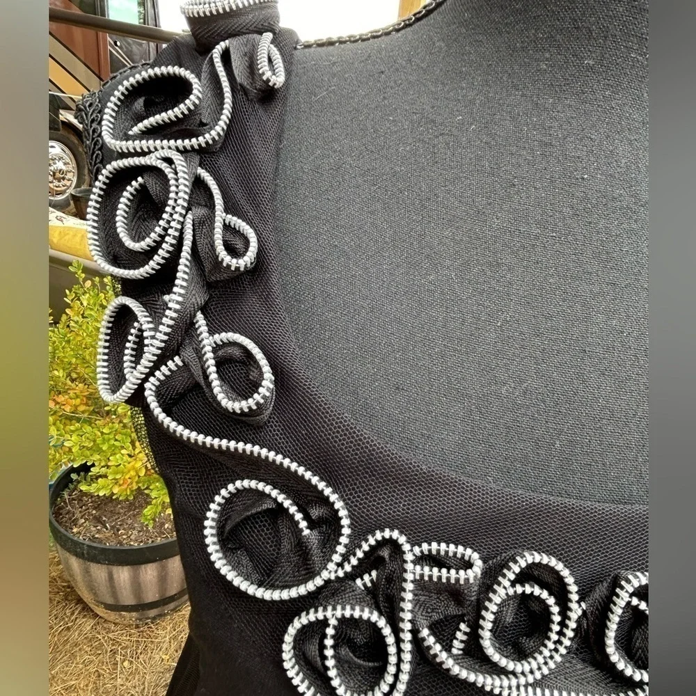 Tiana B. Dress with tiered skirt. Sleeveless. Size S. Black.
